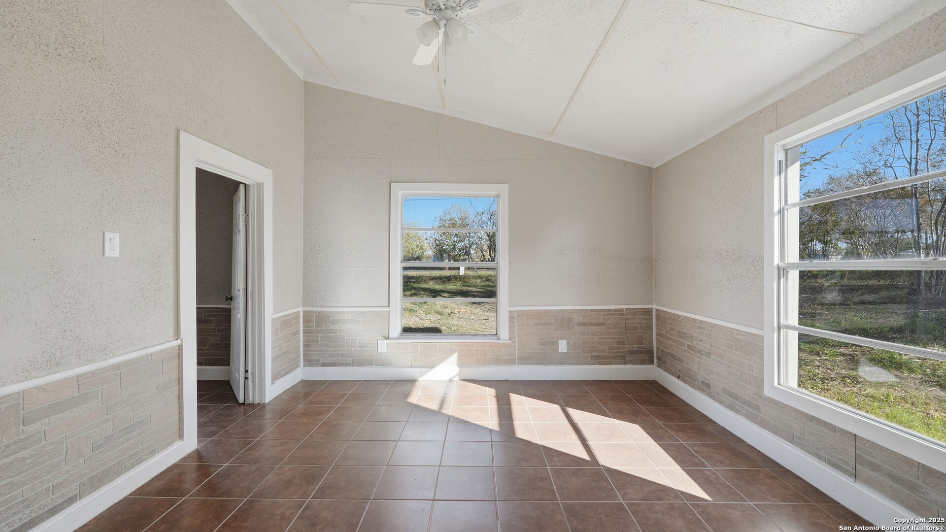 13895 Wisdom Road Atascosa, TX 78002 - Photo 13 of 48 a bathroom with a bathtub and window