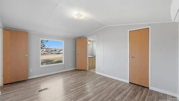 an empty room with wooden floor