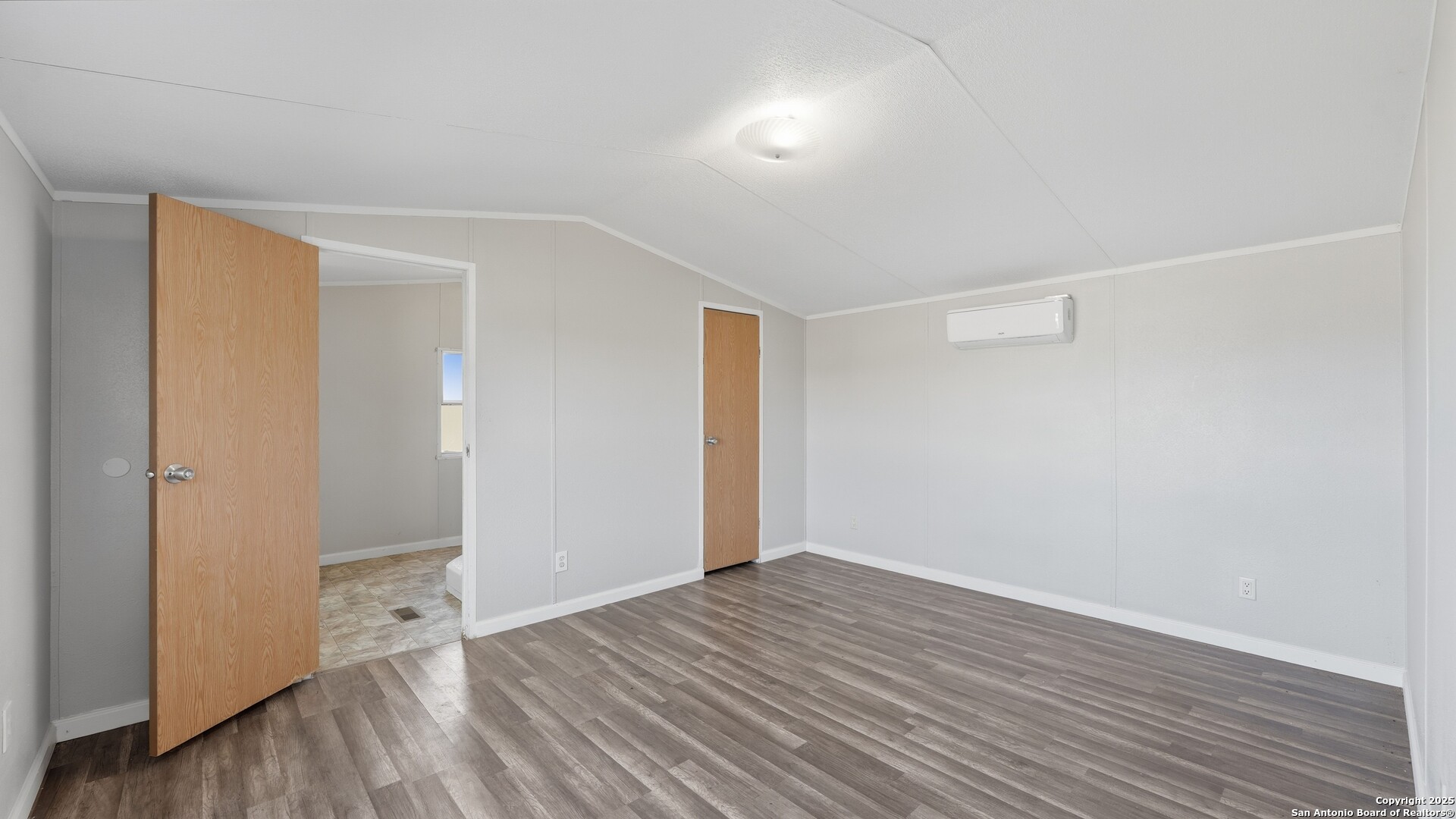 13895 Wisdom Road Atascosa, TX 78002 - Photo 25 of 48 an empty room with wooden floor