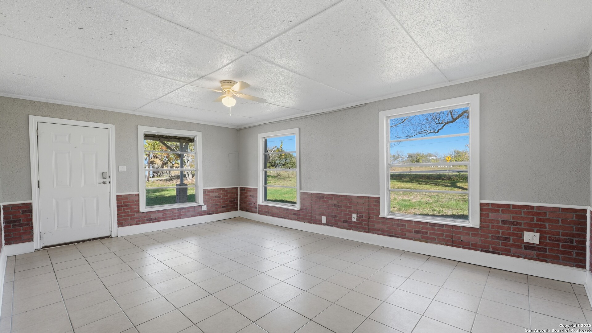 13895 Wisdom Road Atascosa, TX 78002 - Photo 3 of 48 wooden floor in an empty room with a window