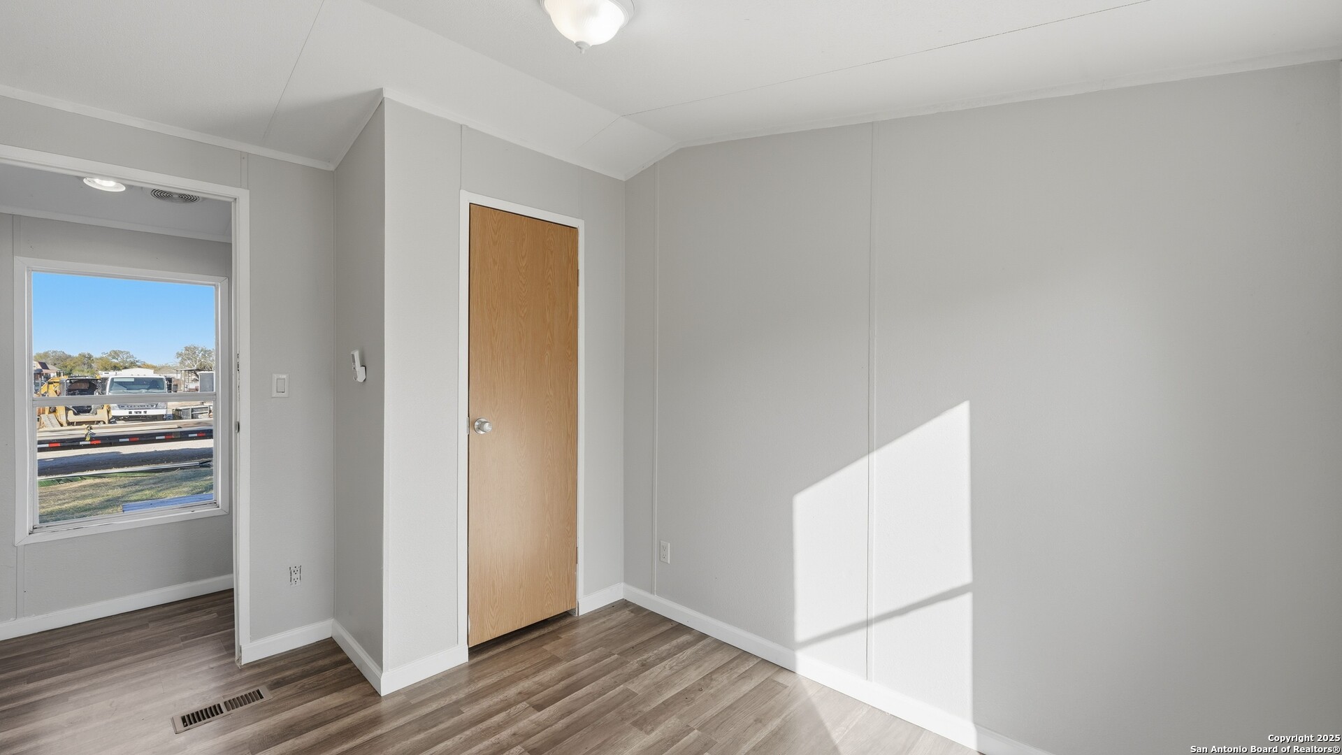 13895 Wisdom Road Atascosa, TX 78002 - Photo 31 of 48 a view of a hallway with wooden floor