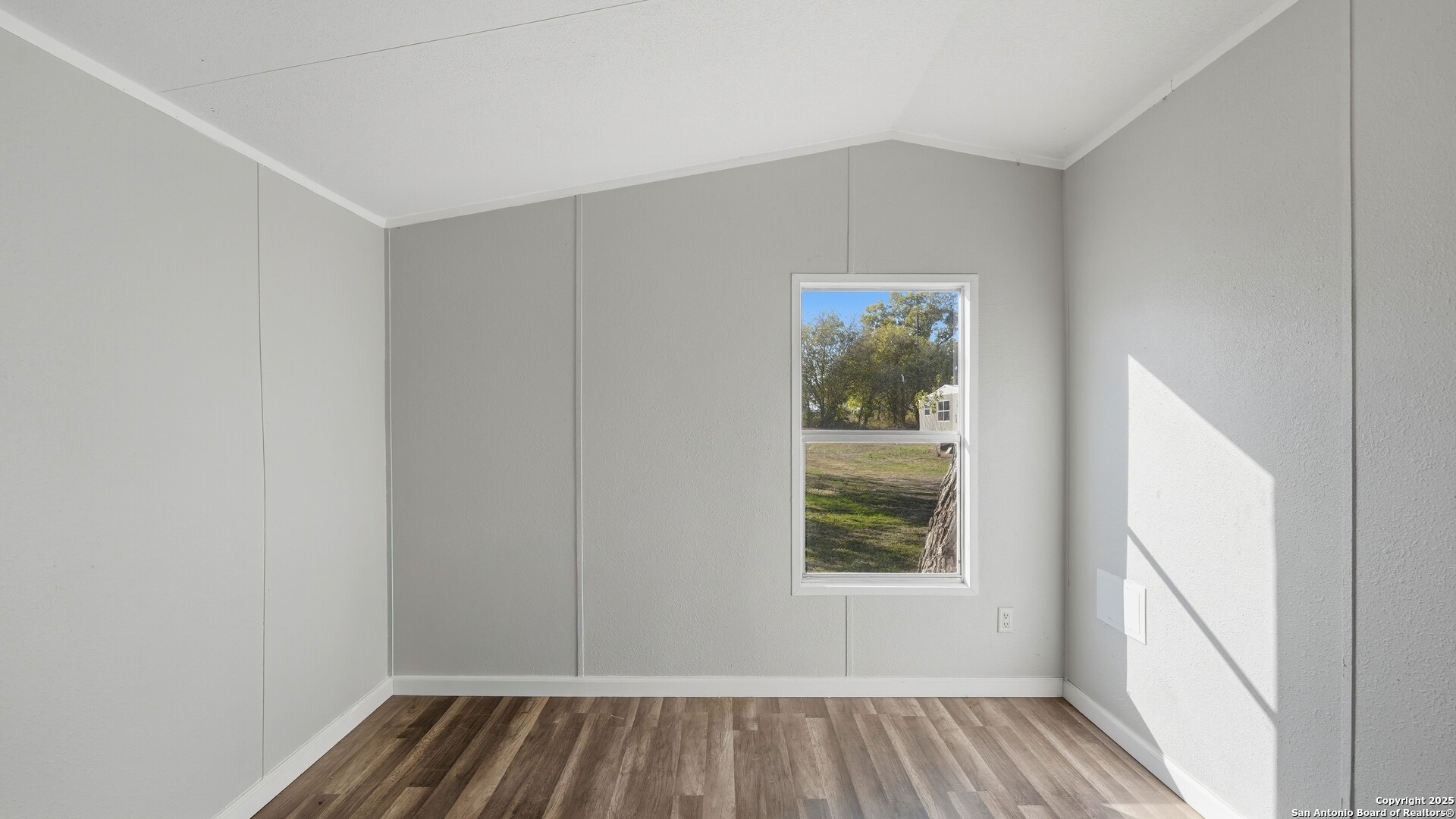 13895 Wisdom Road Atascosa, TX 78002 - Photo 32 of 48 a view of room with window and hardwood floor