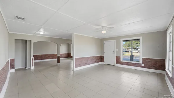 a view of livingroom with an open space and window