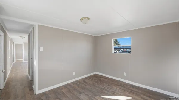 an empty room with a empty space and a window