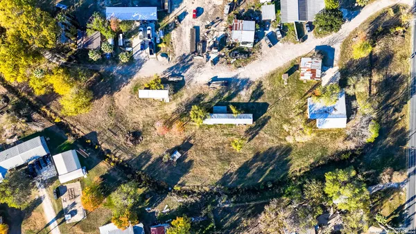 an aerial view of residential building with parking space