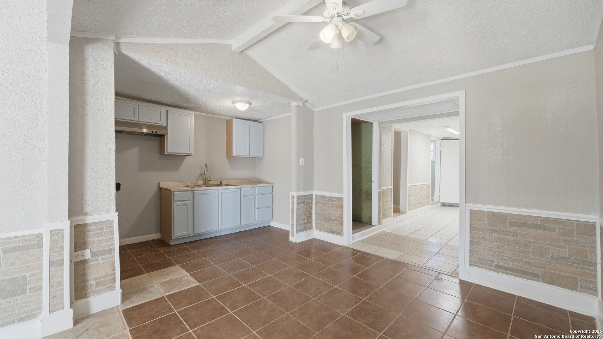 13895 Wisdom Road Atascosa, TX 78002 - Photo 8 of 48 a view of a kitchen with a sink and cabinets