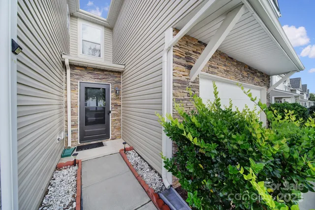 a view of house with wooden door