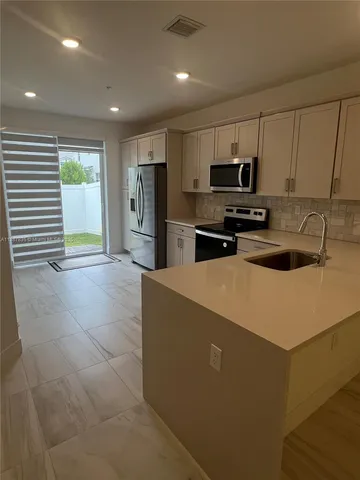 a view of a small space with racks on the wall