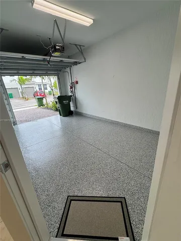 a bathroom with a shower and mirror