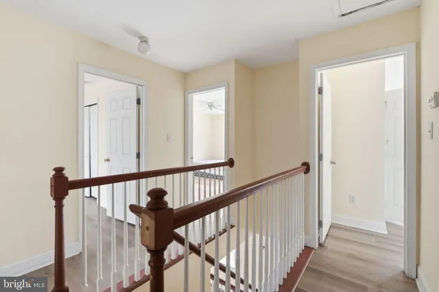 a spacious bathroom with a sink and a mirror