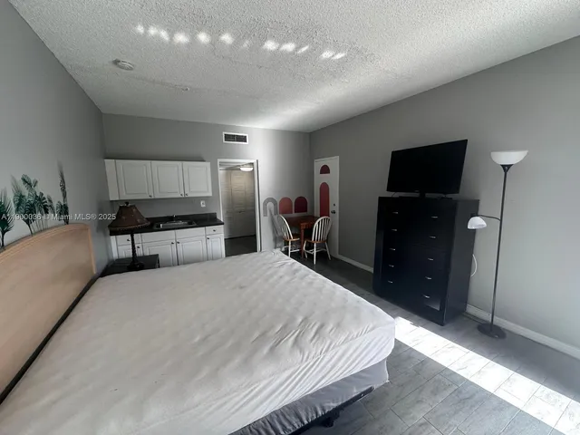 a view of a refrigerator in a kitchen