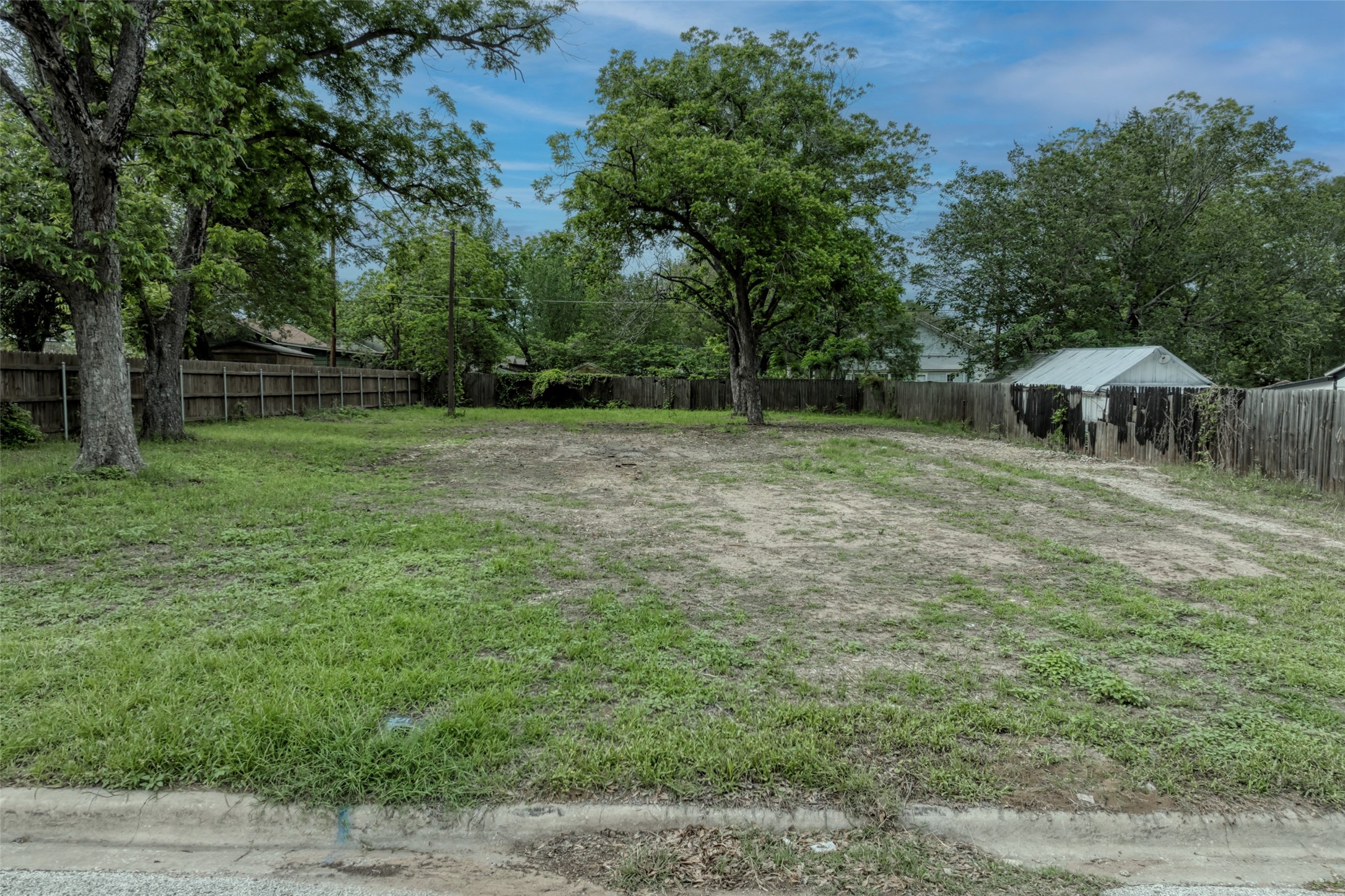 809 East Fannin Street Luling, TX 78648 - Photo 1 of 16 a view of outdoor space with deck and backyard