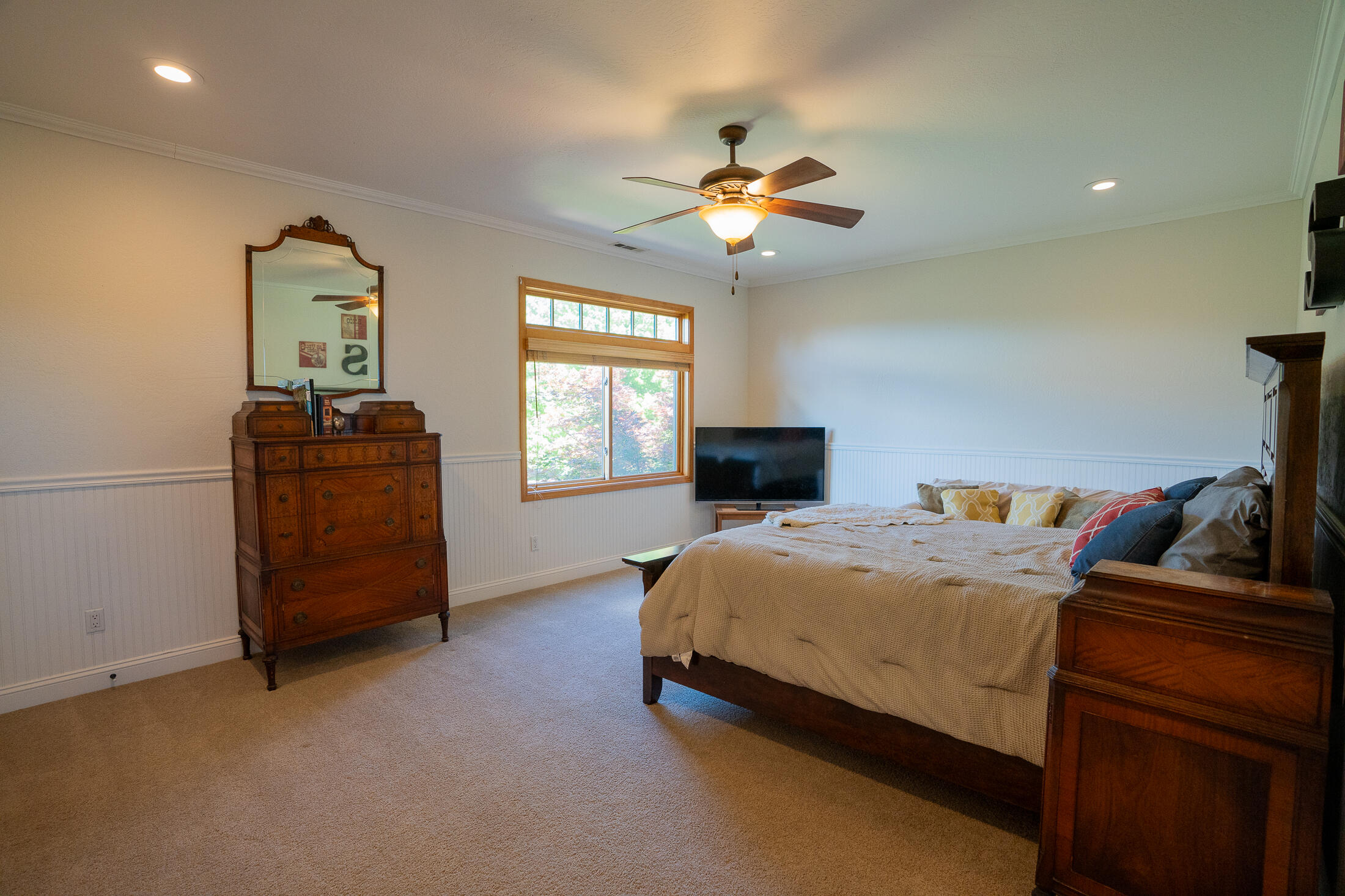 1881 Brophy Road Eagle Point, OR 97524 - Photo 67 of 130 a bedroom with a bed and wooden floor
