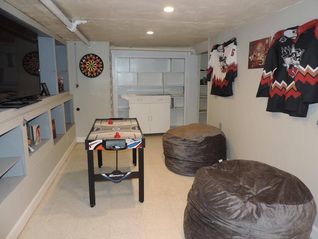 24 Partridge Road Weymouth, MA 02190 - Photo 20 of 24 a living room with furniture and a flat screen tv