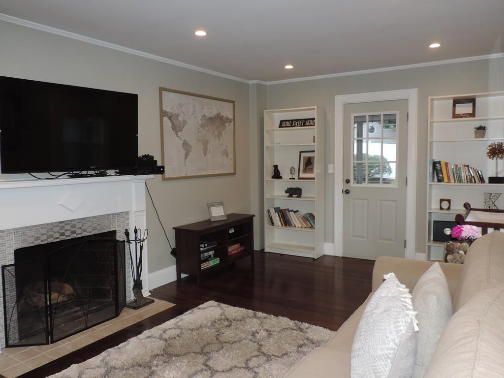 24 Partridge Road Weymouth, MA 02190 - Photo 9 of 24 a living room with furniture and a flat screen tv