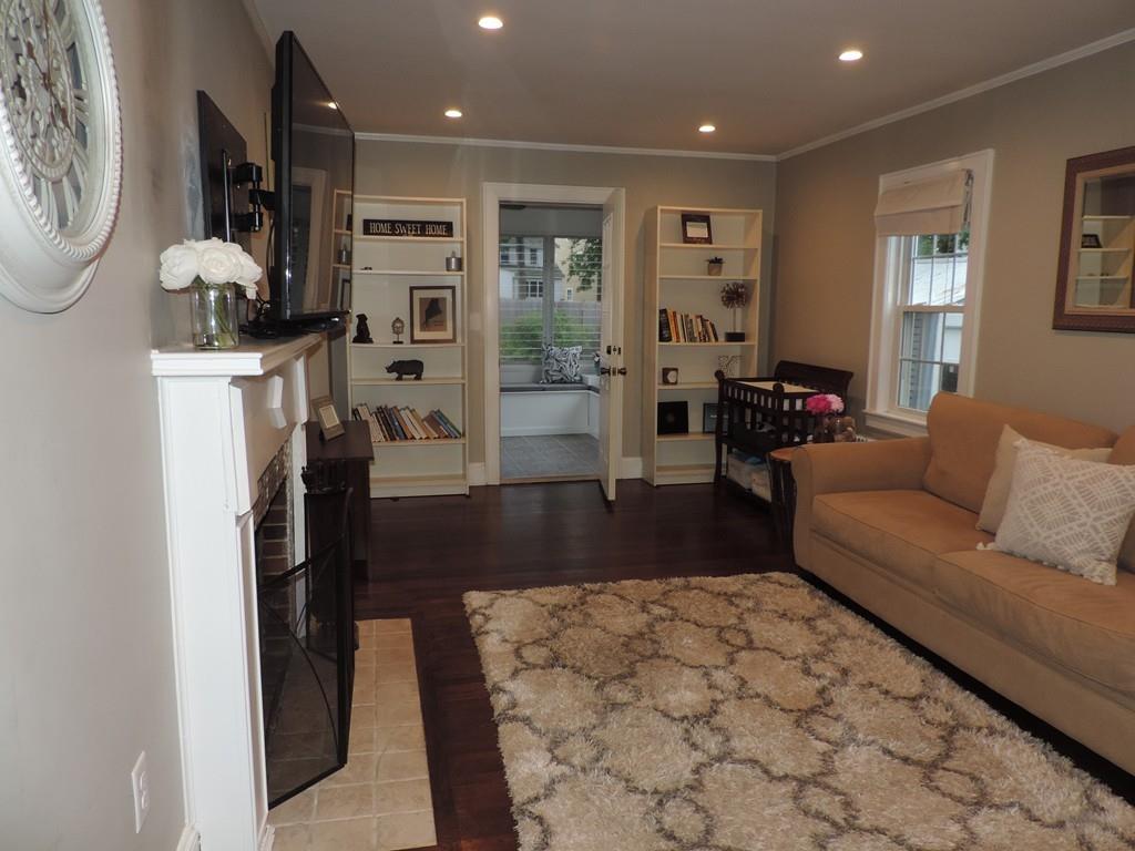 24 Partridge Road Weymouth, MA 02190 - Photo 10 of 24 a living room with furniture and a flat screen tv