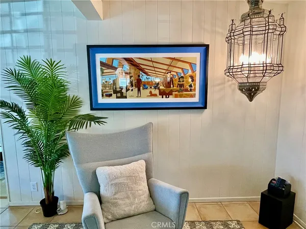 a living room with furniture fireplace and a table