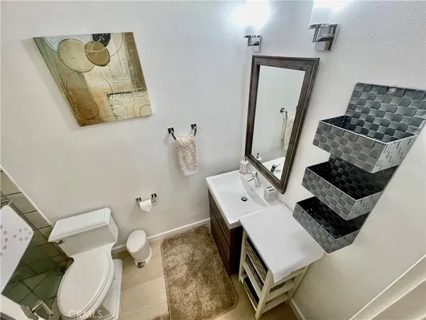 a bedroom with two beds and a table