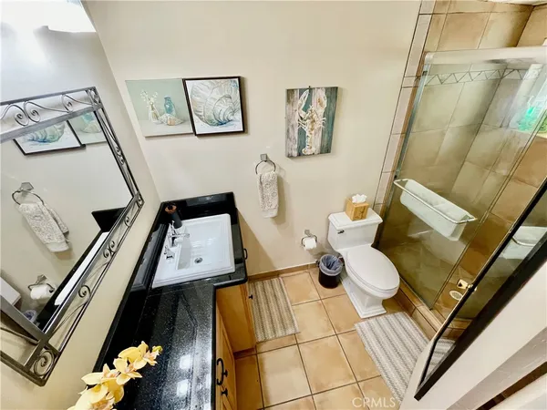 a view of a room with furniture and floor to ceiling window