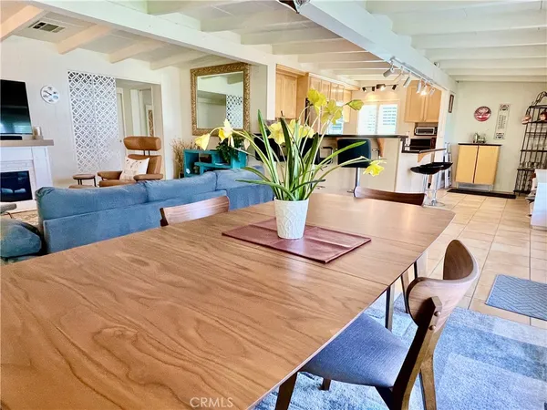 a dining room with furniture and wooden floor