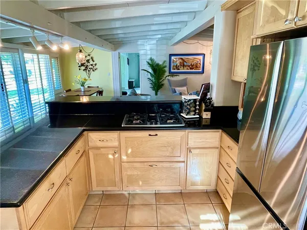 a kitchen with stainless steel appliances a counter space and cabinets