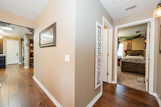 a view of a bedroom from a hallway