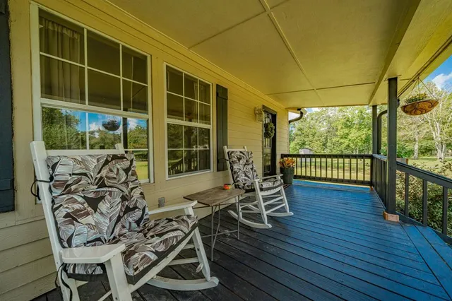 a view of a balcony with chairs