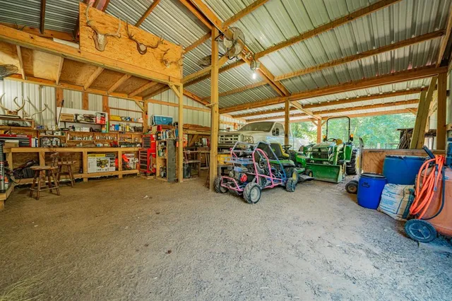 a view of a garage with a table and chairs