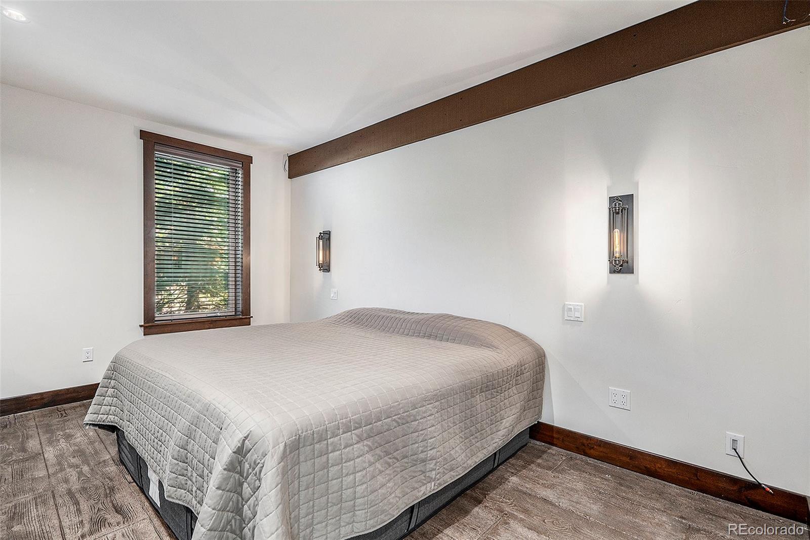 602 Spruce Street Red Cliff, CO 81649 - Photo 15 of 44 a bedroom with a bed and a window