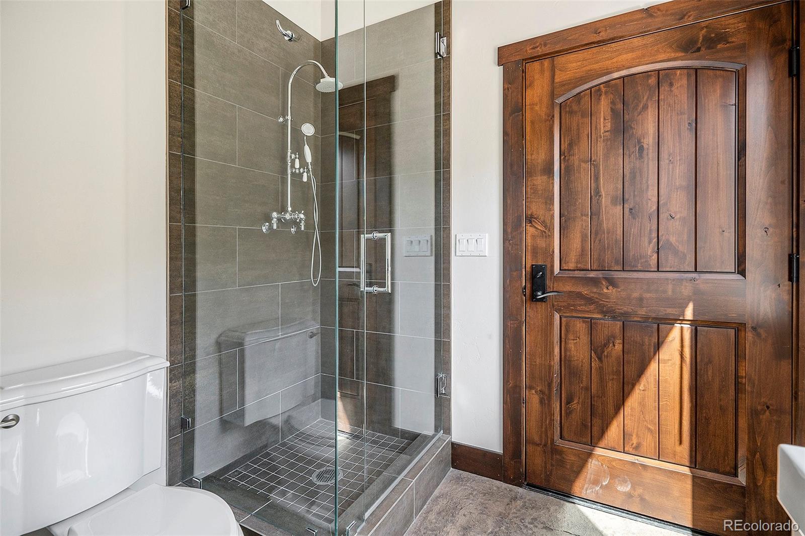 602 Spruce Street Red Cliff, CO 81649 - Photo 26 of 44 a bathroom with a shower and toilet