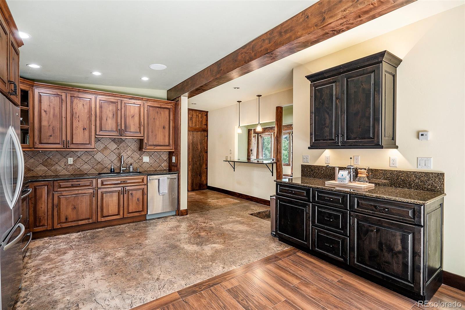 602 Spruce Street Red Cliff, CO 81649 - Photo 5 of 44 a kitchen with stainless steel appliances granite countertop a stove and a sink