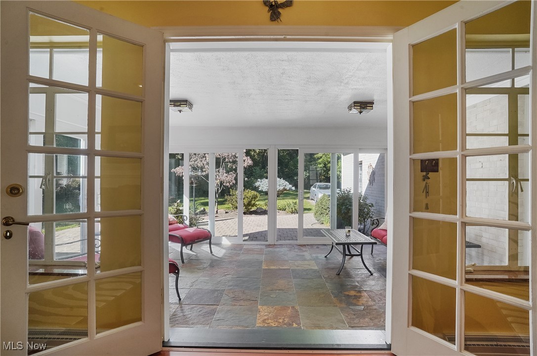 2441 Stockbridge Road Akron, OH 44313 - Photo 13 of 43 French doors leading from living room into 3 season room and back yard