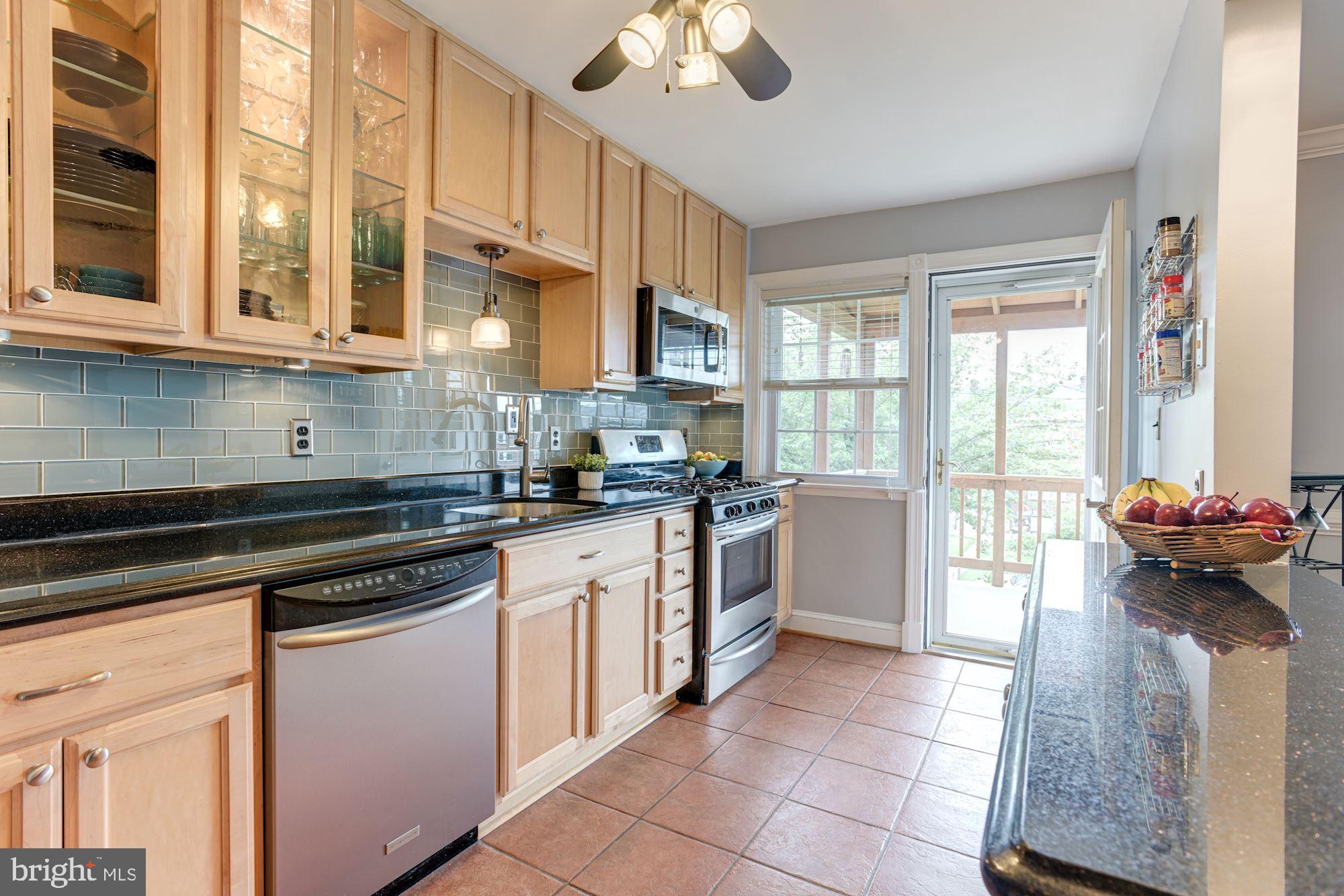 417 Whitfield Road Baltimore, MD 21228 - Photo 13 of 31 a kitchen with a sink appliances cabinets and furniture