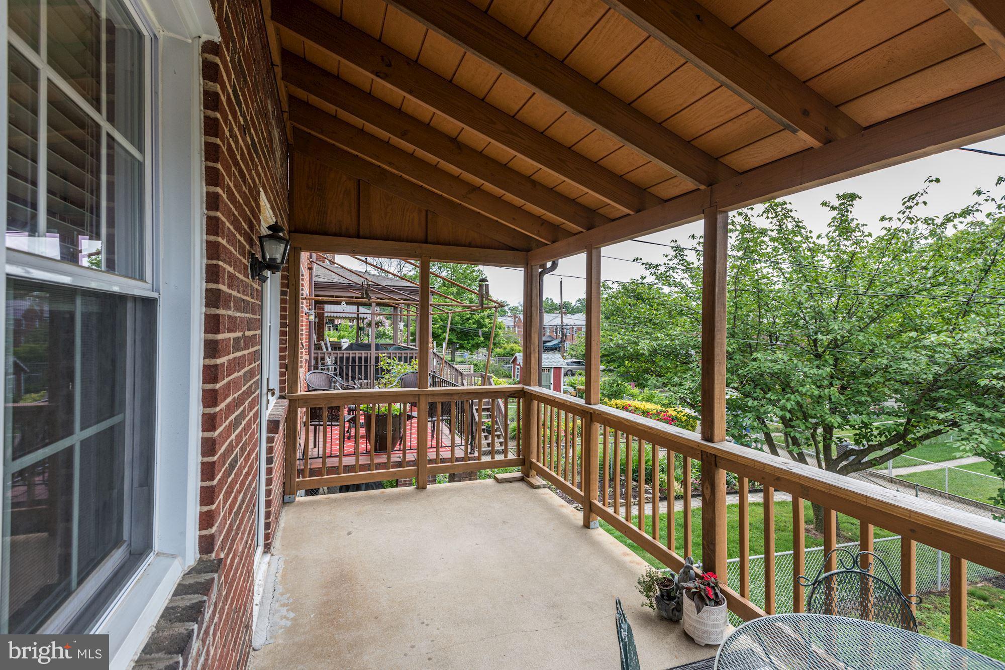 417 Whitfield Road Baltimore, MD 21228 - Photo 18 of 31 a view of porch with green trees in front