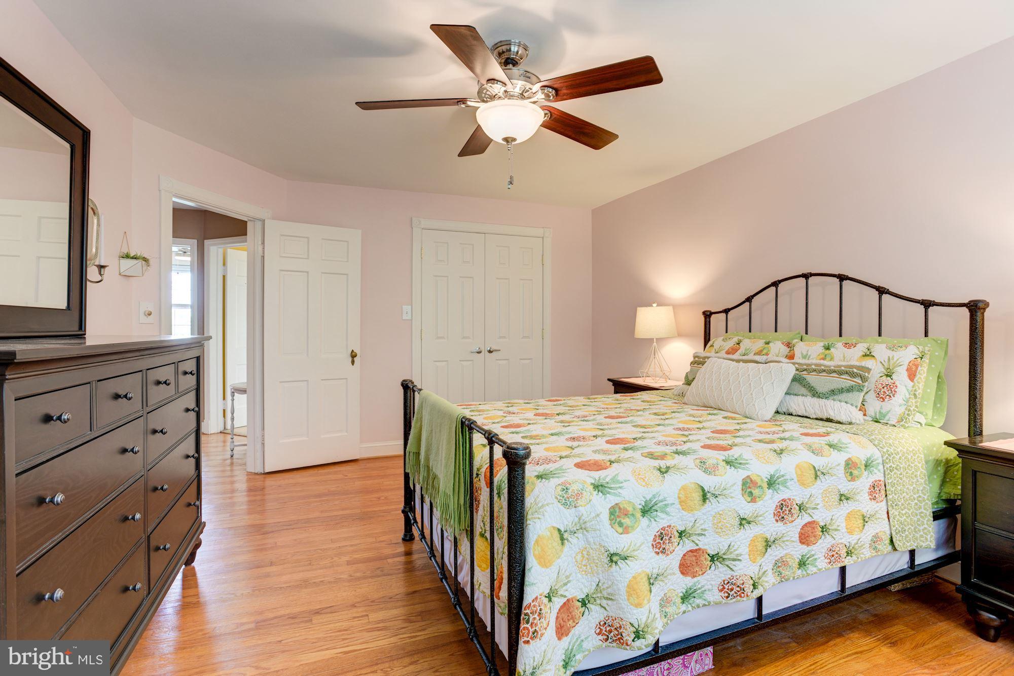 417 Whitfield Road Baltimore, MD 21228 - Photo 20 of 31 a bedroom with a bed and a chandelier