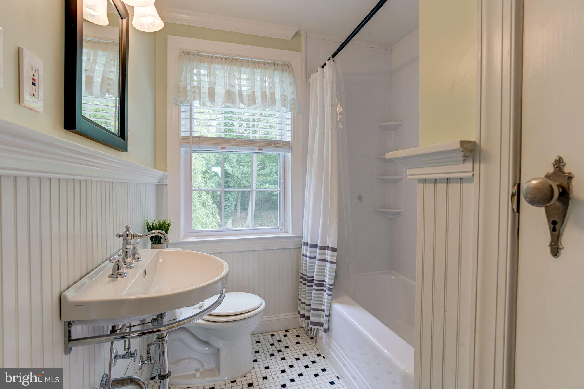 417 Whitfield Road Baltimore, MD 21228 - Photo 22 of 31 a bathroom with a sink a toilet and shower