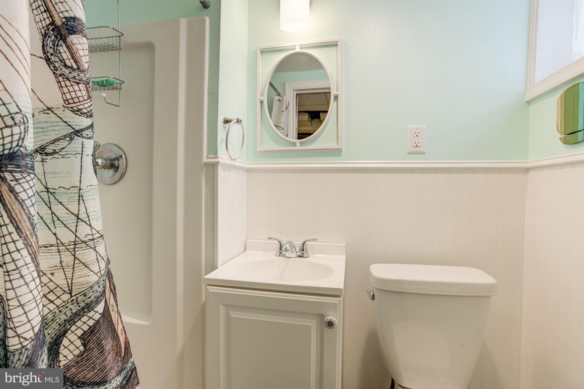 417 Whitfield Road Baltimore, MD 21228 - Photo 26 of 31 a bathroom with a sink and a mirror