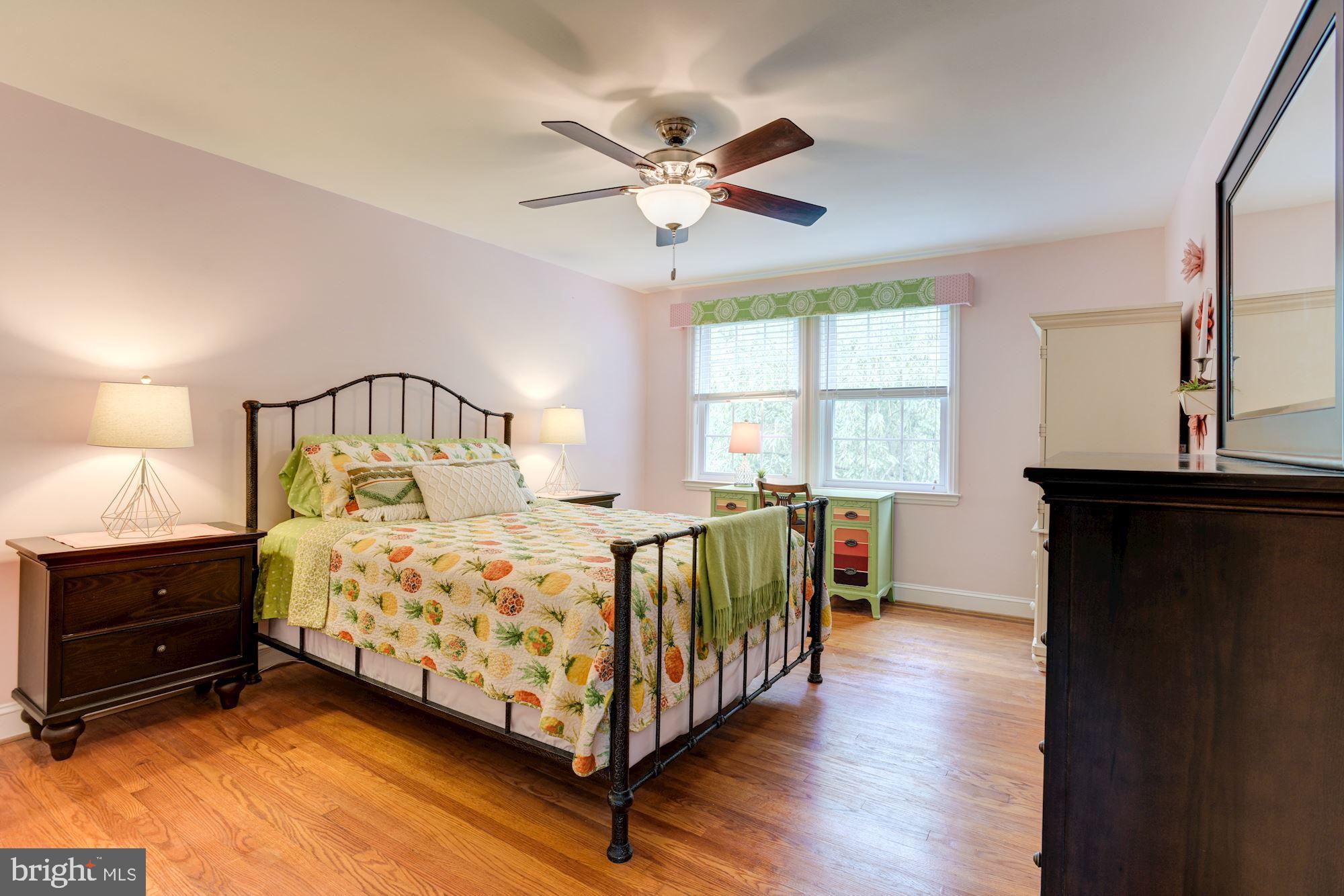 417 Whitfield Road Baltimore, MD 21228 - Photo 4 of 31 a bedroom with a bed a window and a chandelier