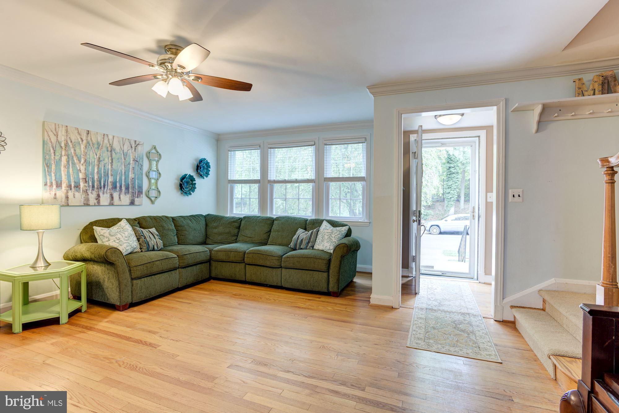 417 Whitfield Road Baltimore, MD 21228 - Photo 8 of 31 a living room with furniture and a large window