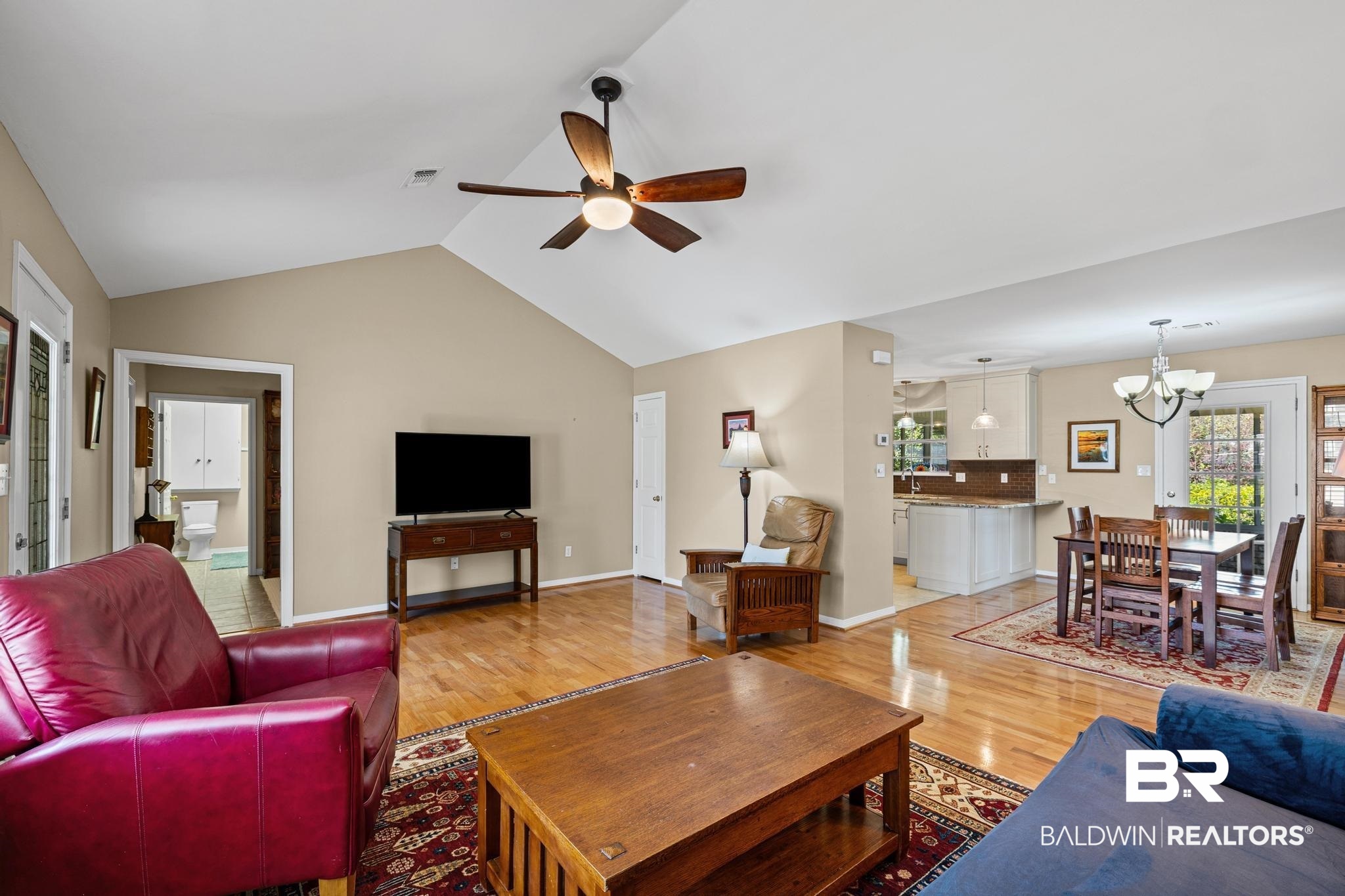 2881 Eslava Circle Lillian, AL 36549 - Photo 6 of 58 Living room featuring light wood-type flooring, ceiling fan, and suspended lighting