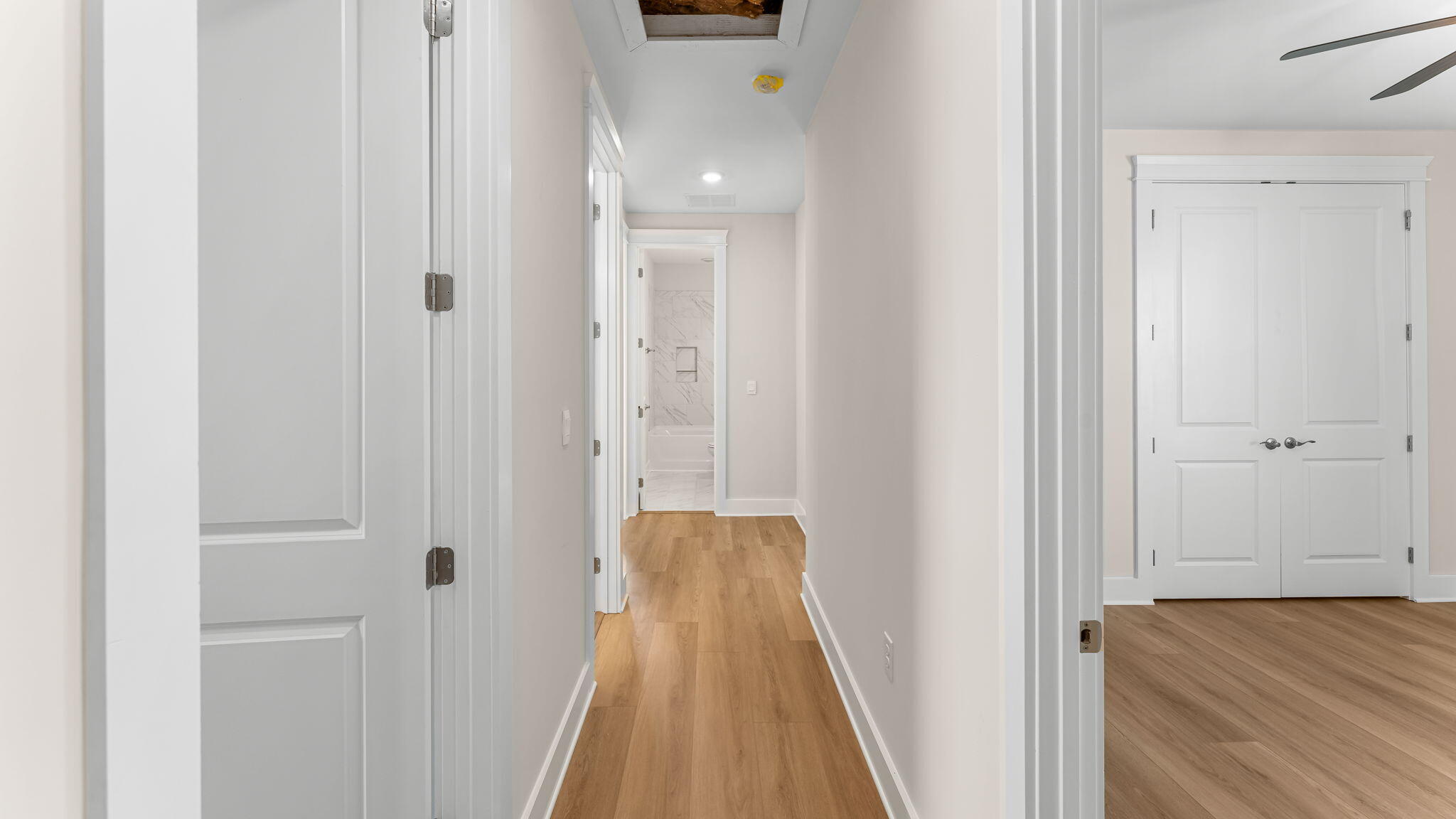 123 Marsh View Ridge Ln Cape Port St. Joe, FL 32456 - Photo 20 of 34 a view of a hallway with wooden floor and staircase