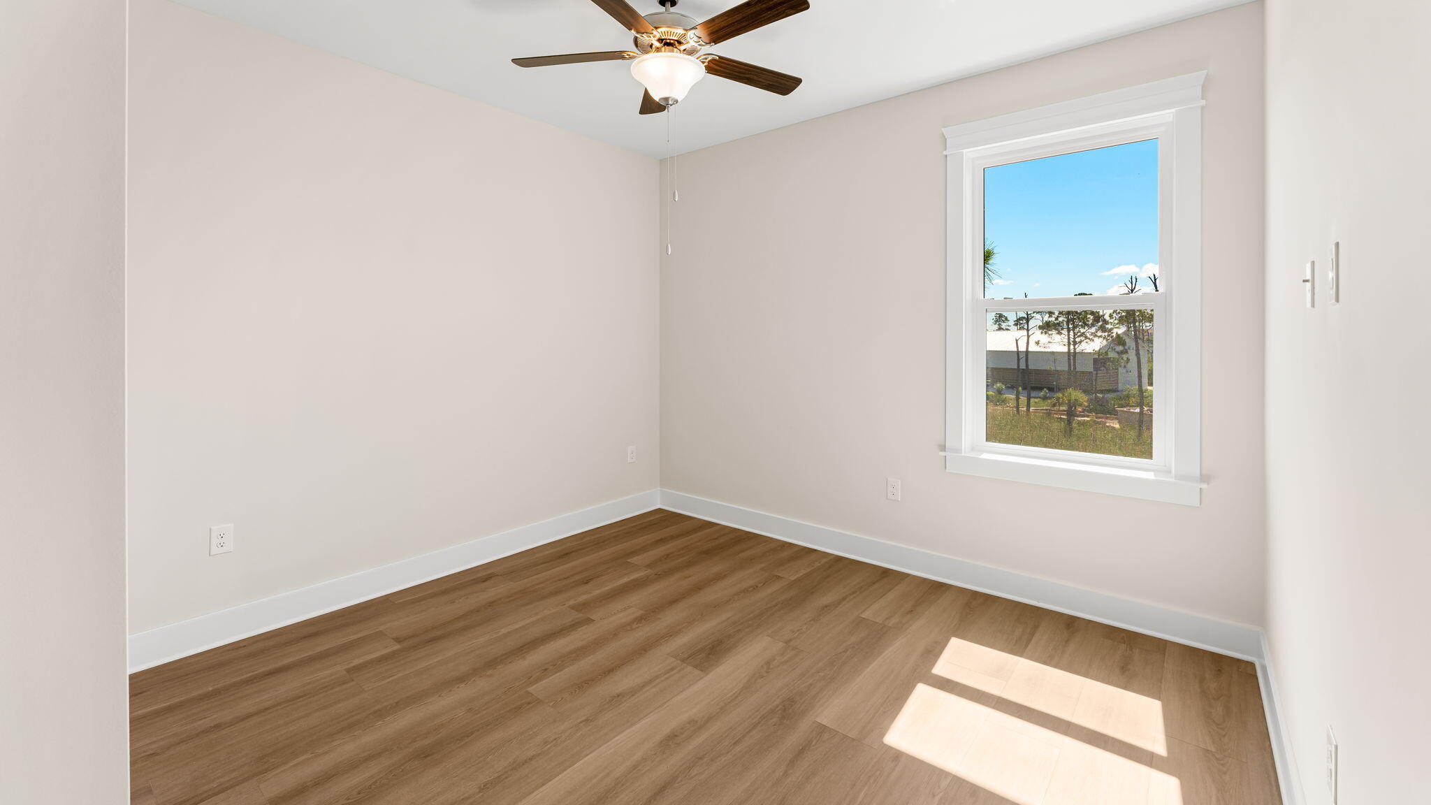 123 Marsh View Ridge Ln Cape Port St. Joe, FL 32456 - Photo 28 of 34 an empty room with a window and a ceiling fan