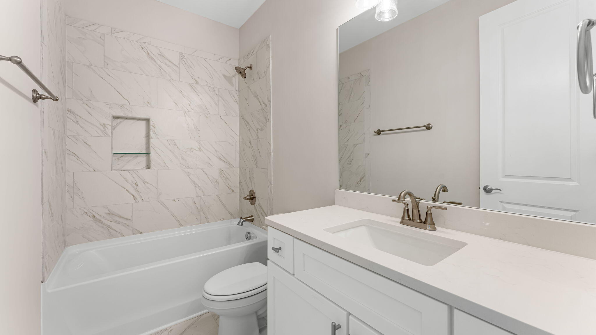 123 Marsh View Ridge Ln Cape Port St. Joe, FL 32456 - Photo 30 of 34 a bathroom with a sink a toilet and a bathtub