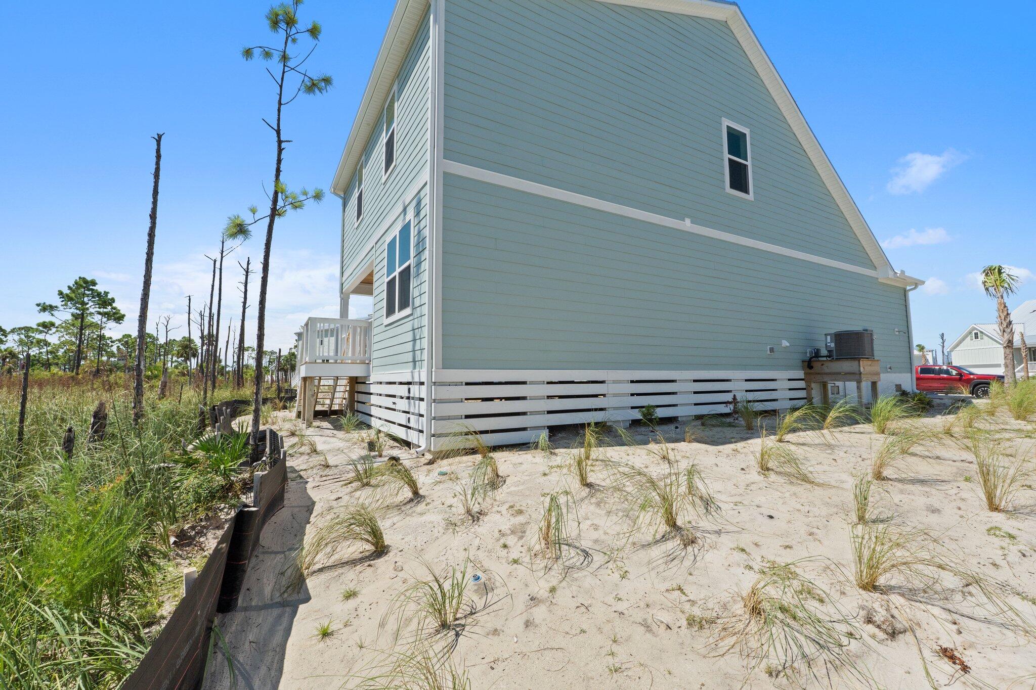123 Marsh View Ridge Ln Cape Port St. Joe, FL 32456 - Photo 33 of 34 a view of a backyard of the house