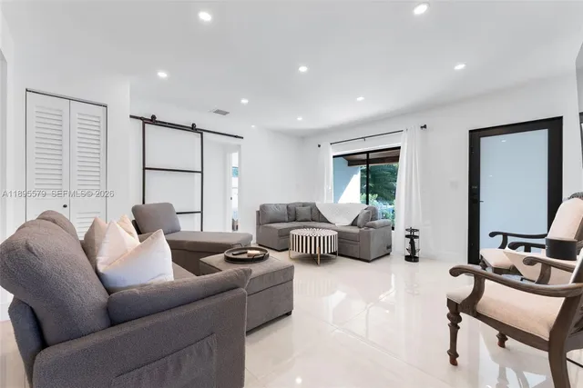 a living room with furniture and a bathtub