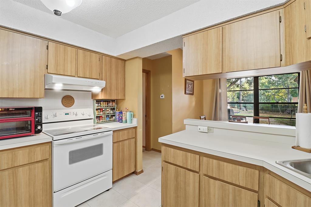 3050 East Possum Court Inverness, FL 34452 - Photo 14 of 65 a kitchen with a stove and a sink