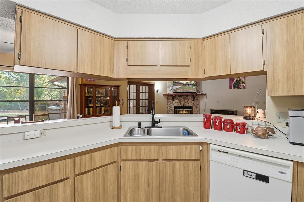 3050 East Possum Court Inverness, FL 34452 - Photo 15 of 65 a kitchen with a sink cabinets and a window