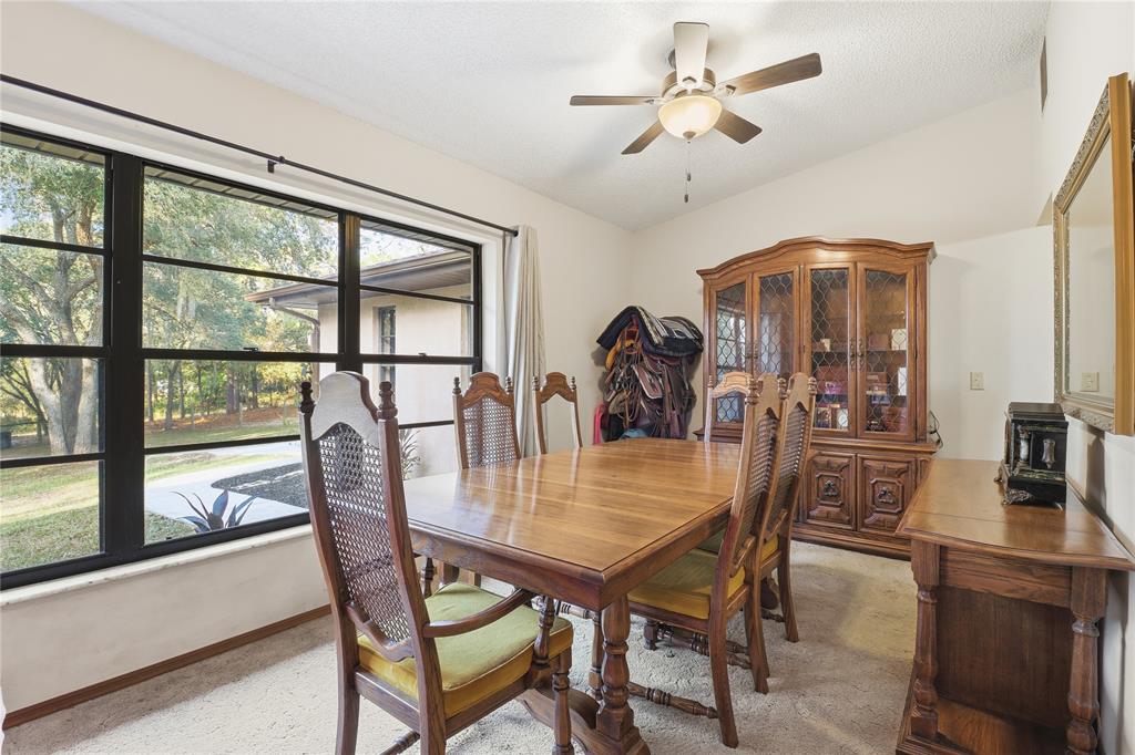 3050 East Possum Court Inverness, FL 34452 - Photo 18 of 65 a view of a dining room with furniture window and outside view