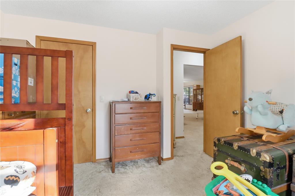 3050 East Possum Court Inverness, FL 34452 - Photo 26 of 65 a bedroom with a bed and furniture