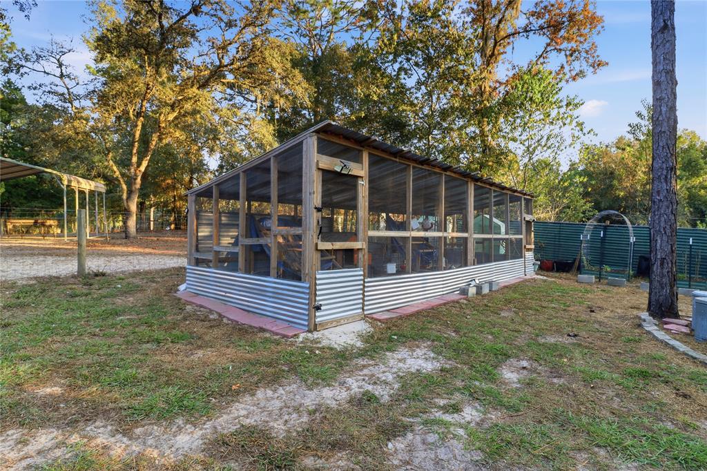 3050 East Possum Court Inverness, FL 34452 - Photo 37 of 65 a front view of a house with a yard